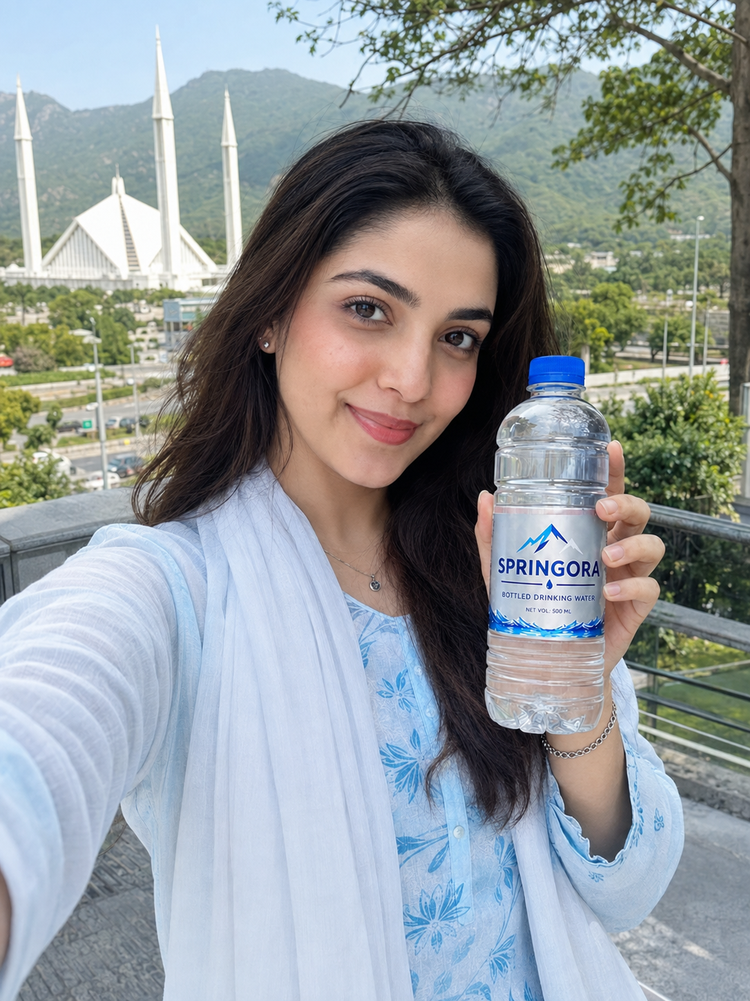 Woman holding a Springora 500 ml bottle in Islamabad